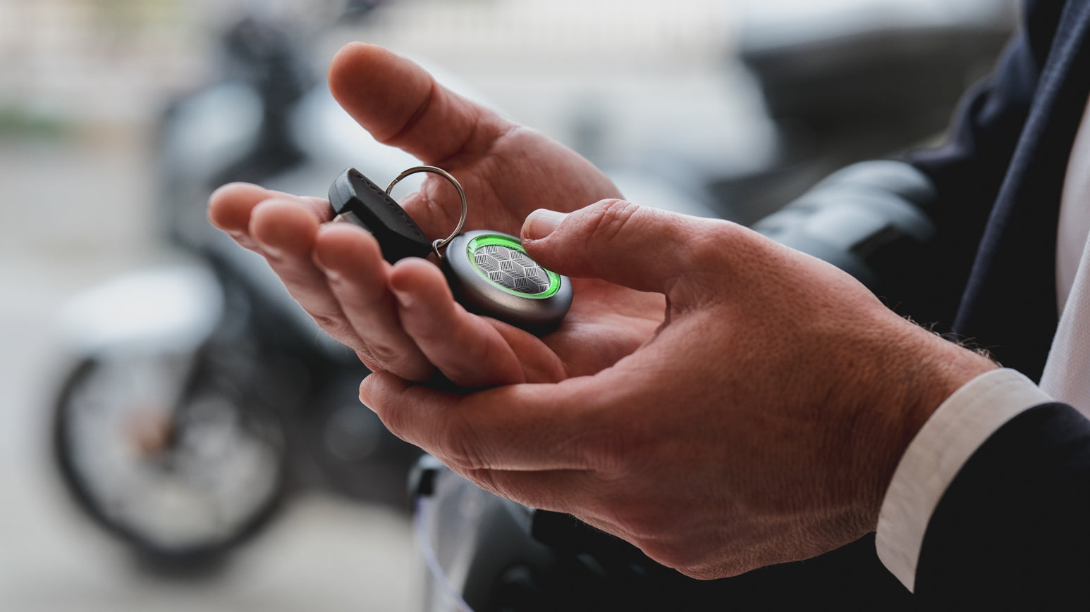 EthyloKey portable touch-based alcohol detector held in hand